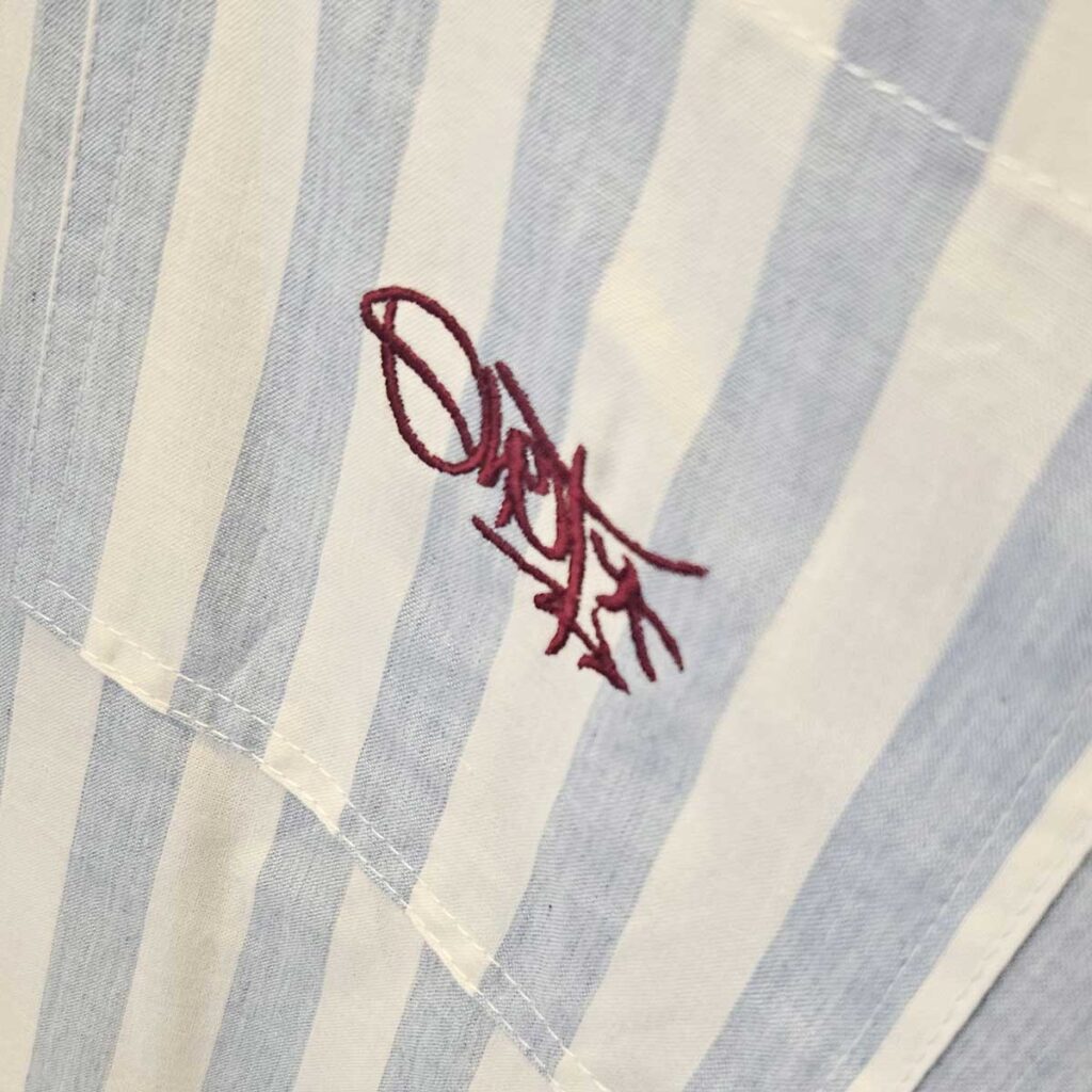 blue striped button-down shirt with embroidered tag logo – ohet clothing